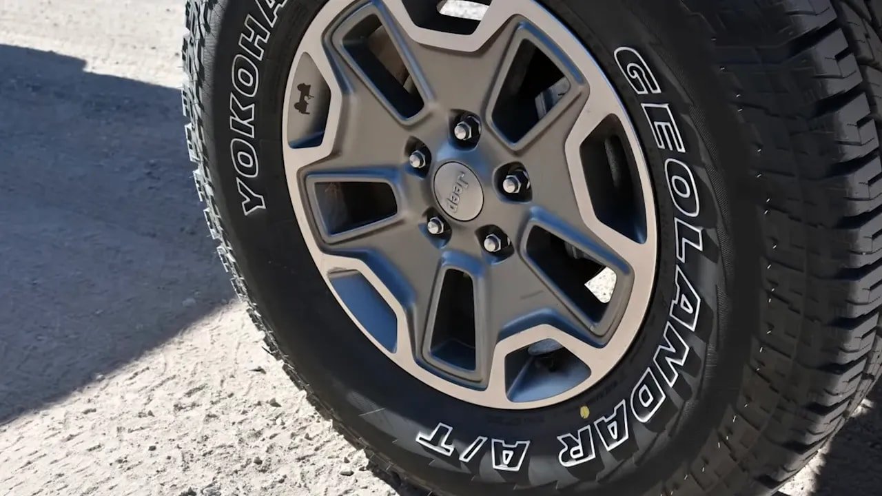 Close-up of all-terrain tire sidewall and tread blocks