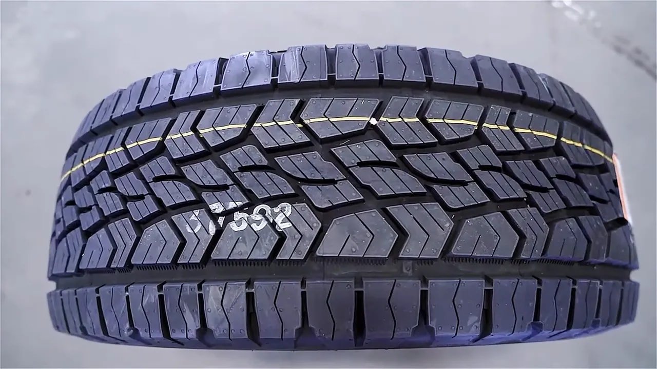 All-terrain tire tread pattern close-up showing block design and grooves