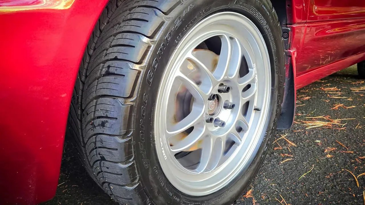 BFGoodrich g-Force COMP-2 A/S Plus tire close-up with wheel and tread detail