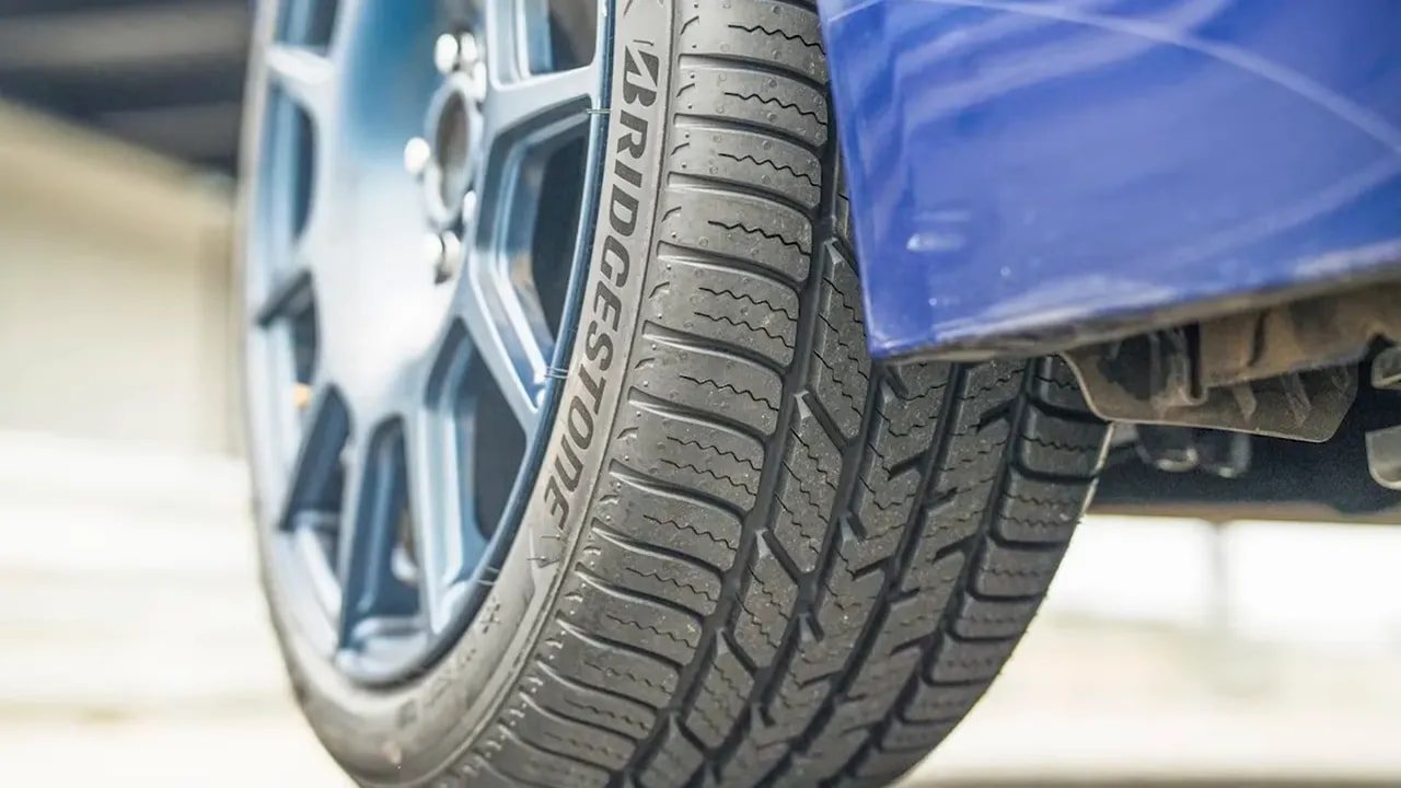 Bridgestone Potenza Sport A/S tire tread close-up showing sipes and grooves