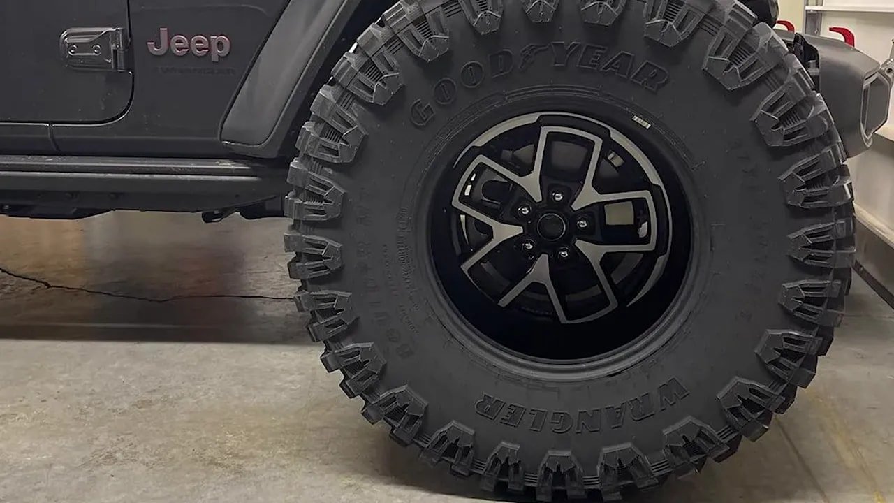 Close-up of a mud-terrain tire tread blocks and sidewall texture
