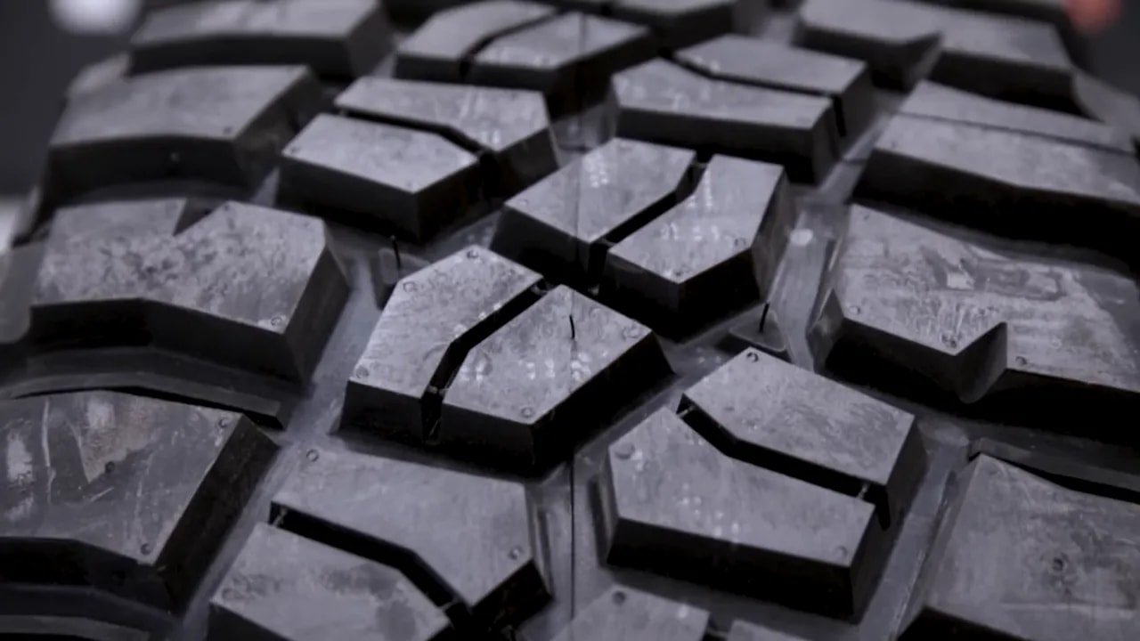 Close-up of aggressive mud-terrain tire tread blocks
