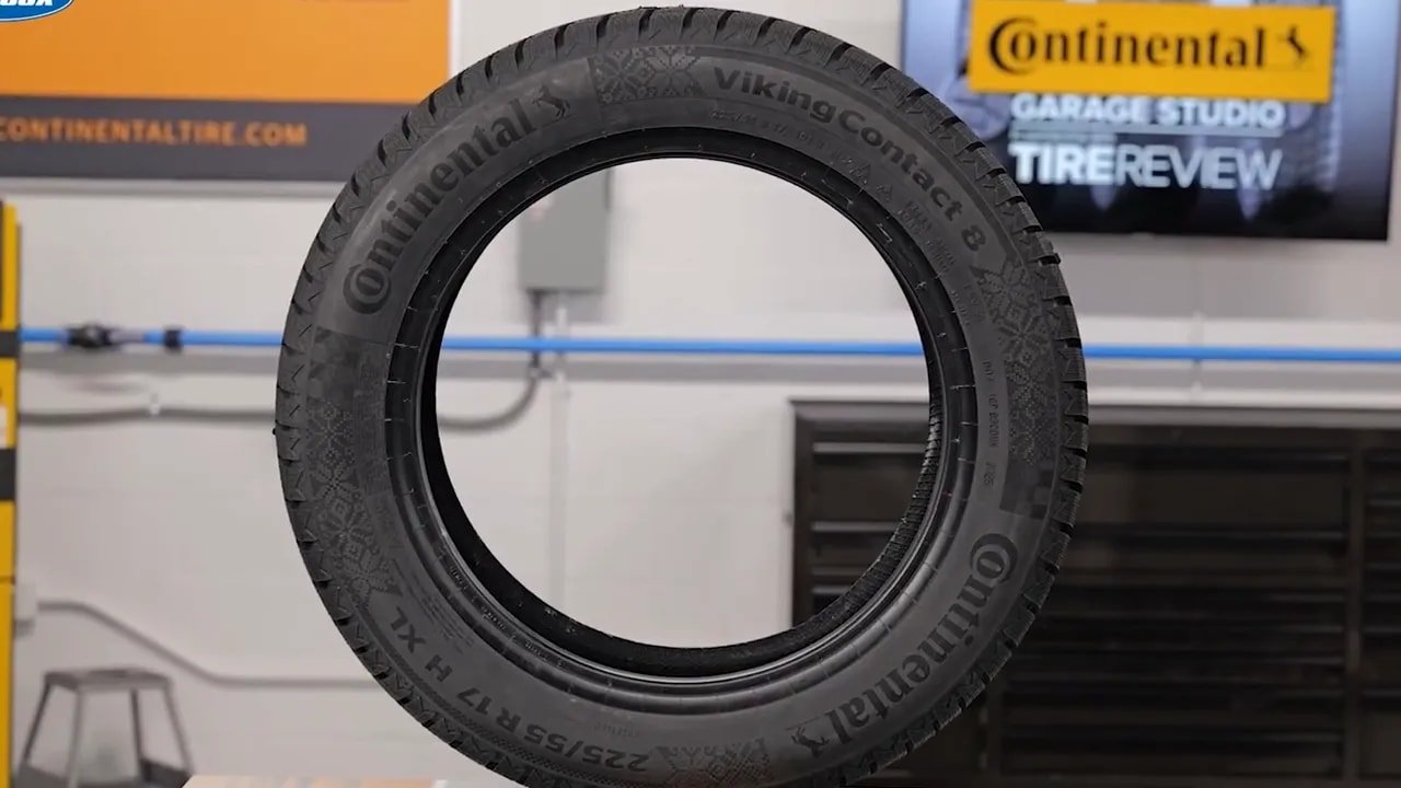 Close-up of Continental VikingContact 8 studless tire tread mounted in a tire shop setting