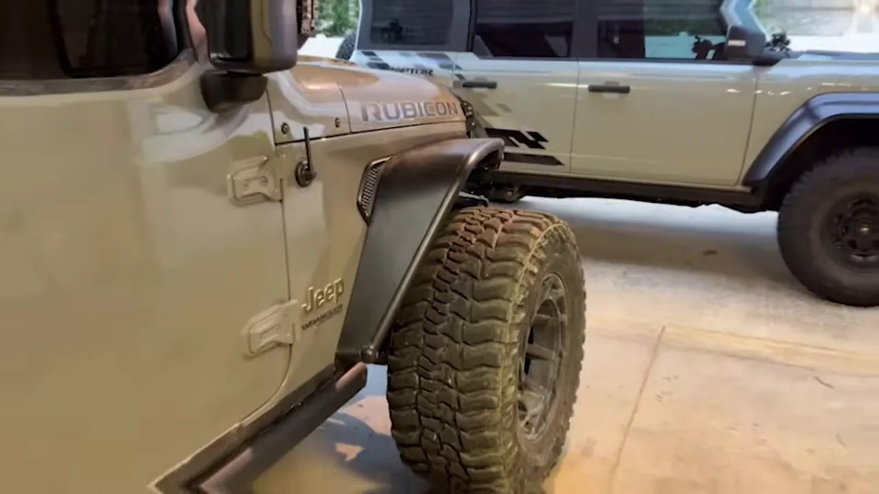 Jeep Rubicon with mud-terrain tire showing deep tread blocks