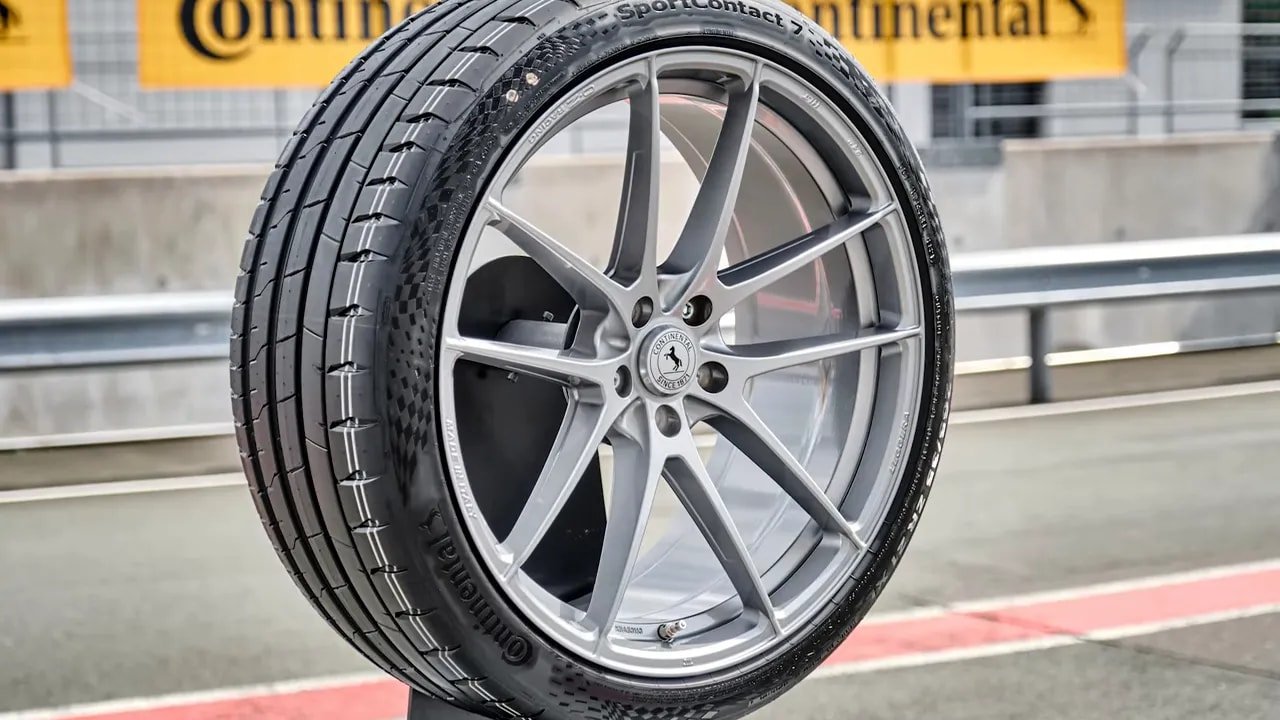 Close-up view of a performance summer tire mounted on a silver wheel
