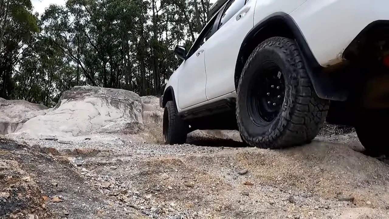 Subaru Forester crossing rocks with all-terrain tires