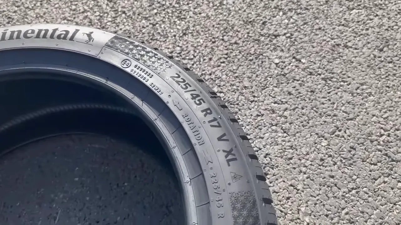 Close-up of tire sidewall showing size and model markings