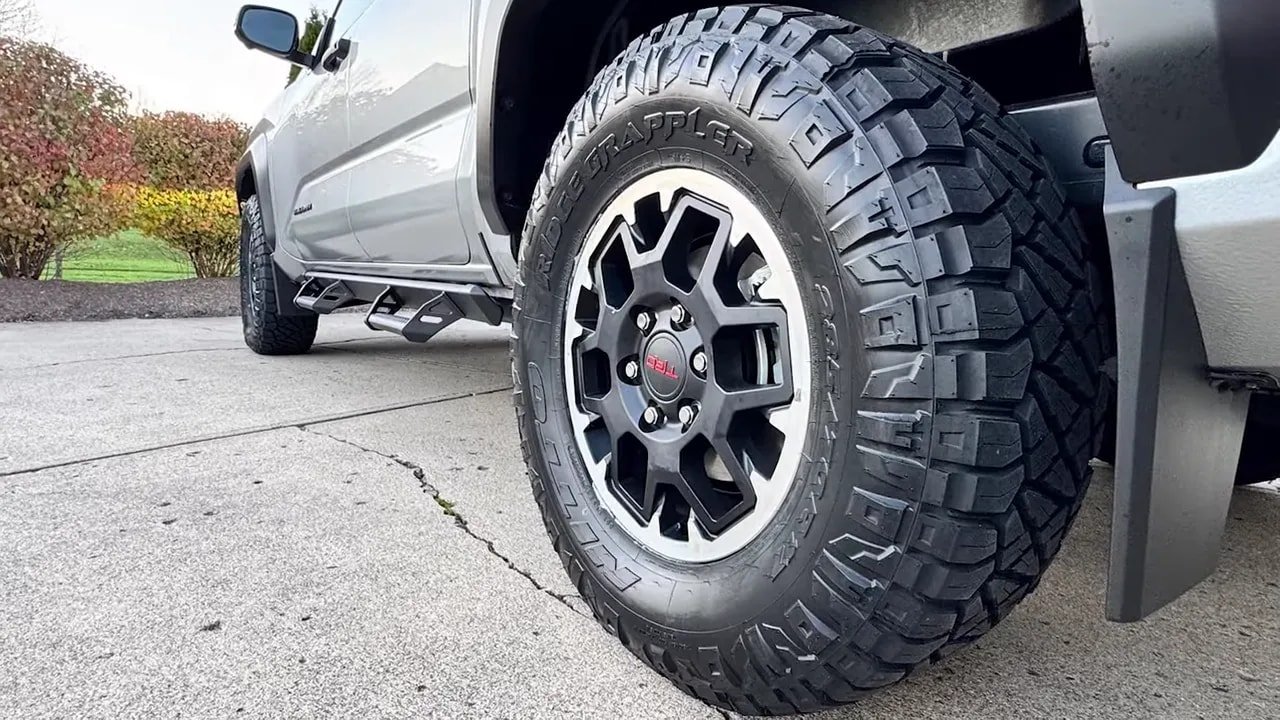 Truck wheel and all-terrain tire with aggressive tread pattern