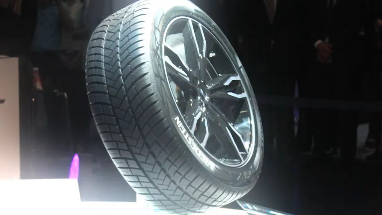 UHP winter tire on display with tread pattern and sidewall visible