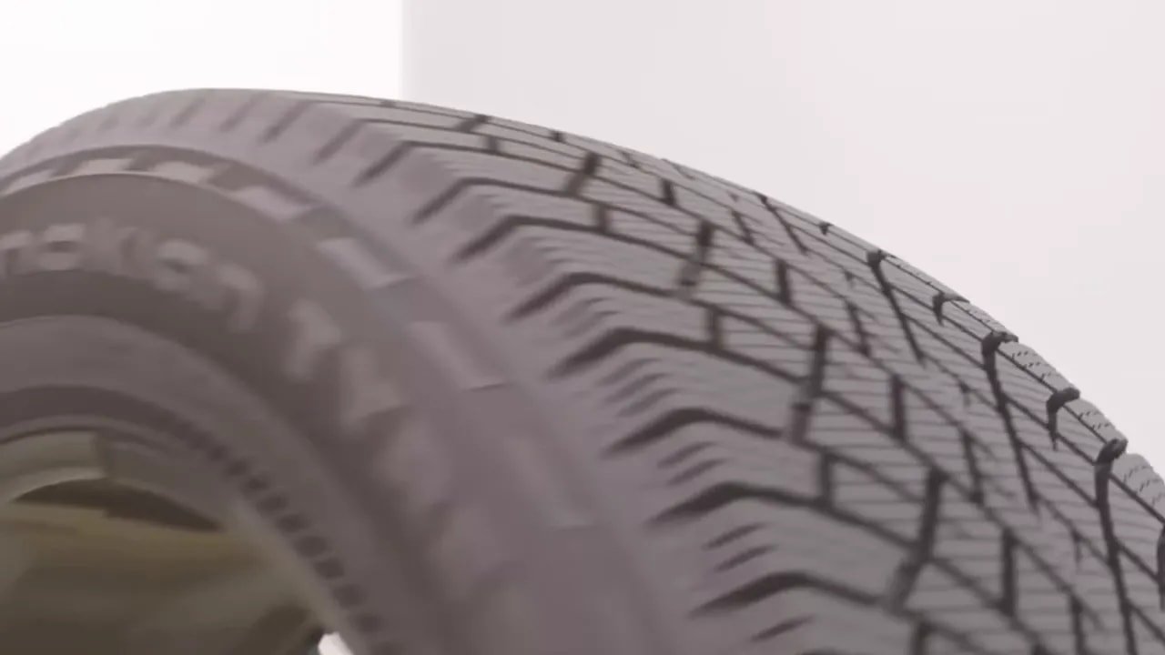 Close-up view of winter tire tread blocks and sipes